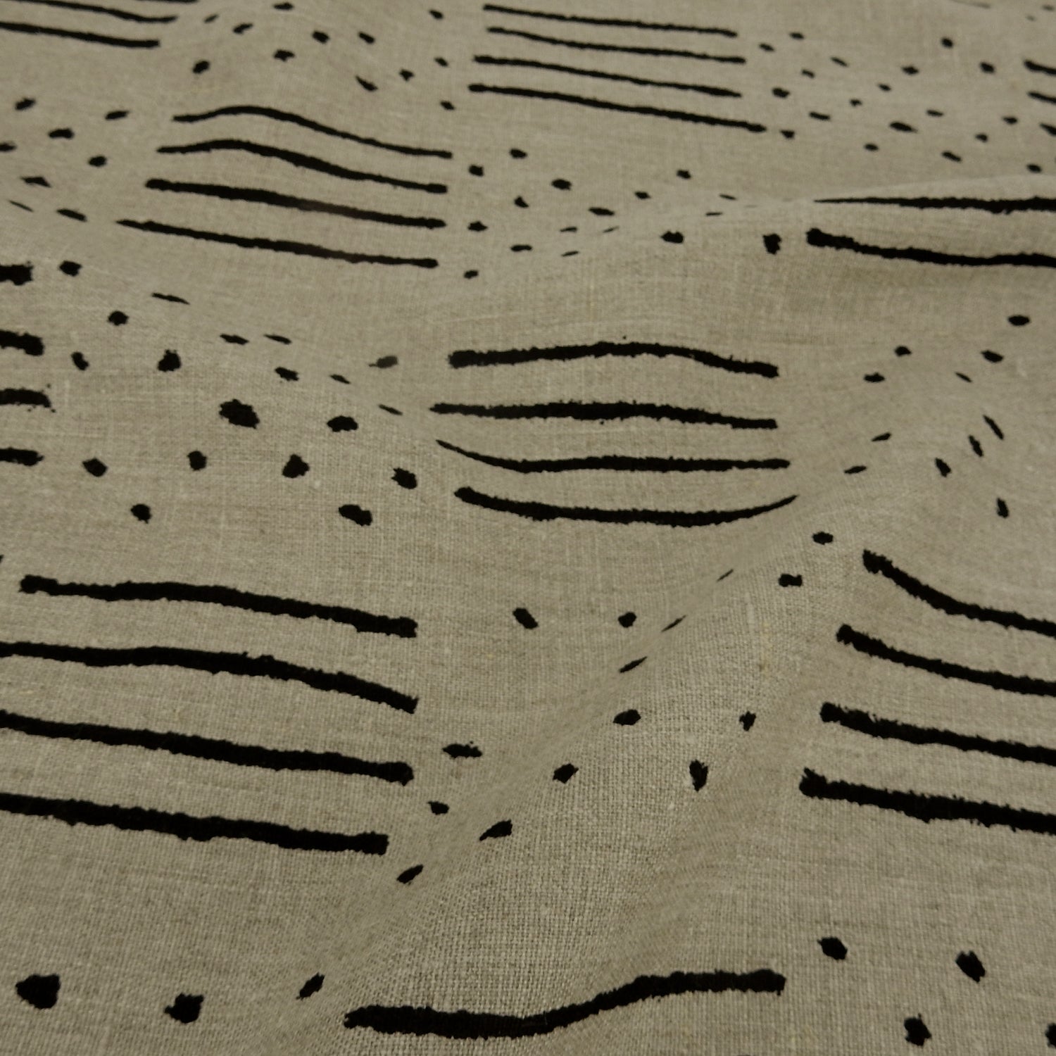 Premium 100% European Linen fabric. African-Inspired natural & black line/dot design. medium weight for apparel & home interior. shown lightly gathered
