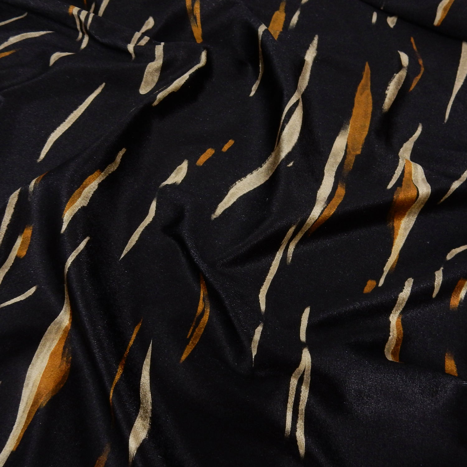 Premium Spanish Vertical Abstract Stripe Stretch Velvet Fabric. Luxury Bronze & Pale Gold design. shown slightly gathered