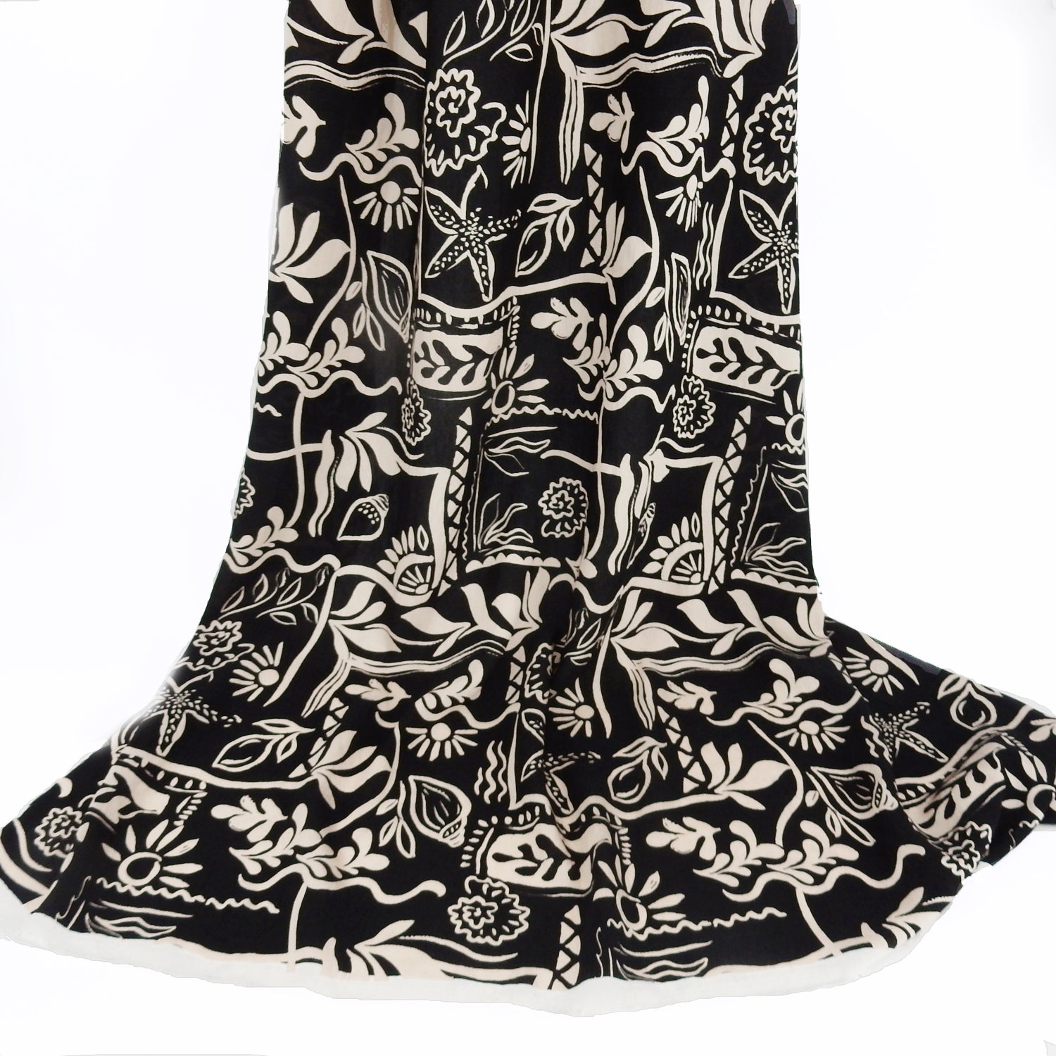 Premium 100% Rayon Challis Fabric. Hand Block Style Print in Black and Beige. Light weight, ultra soft, silk like texture. shown draped