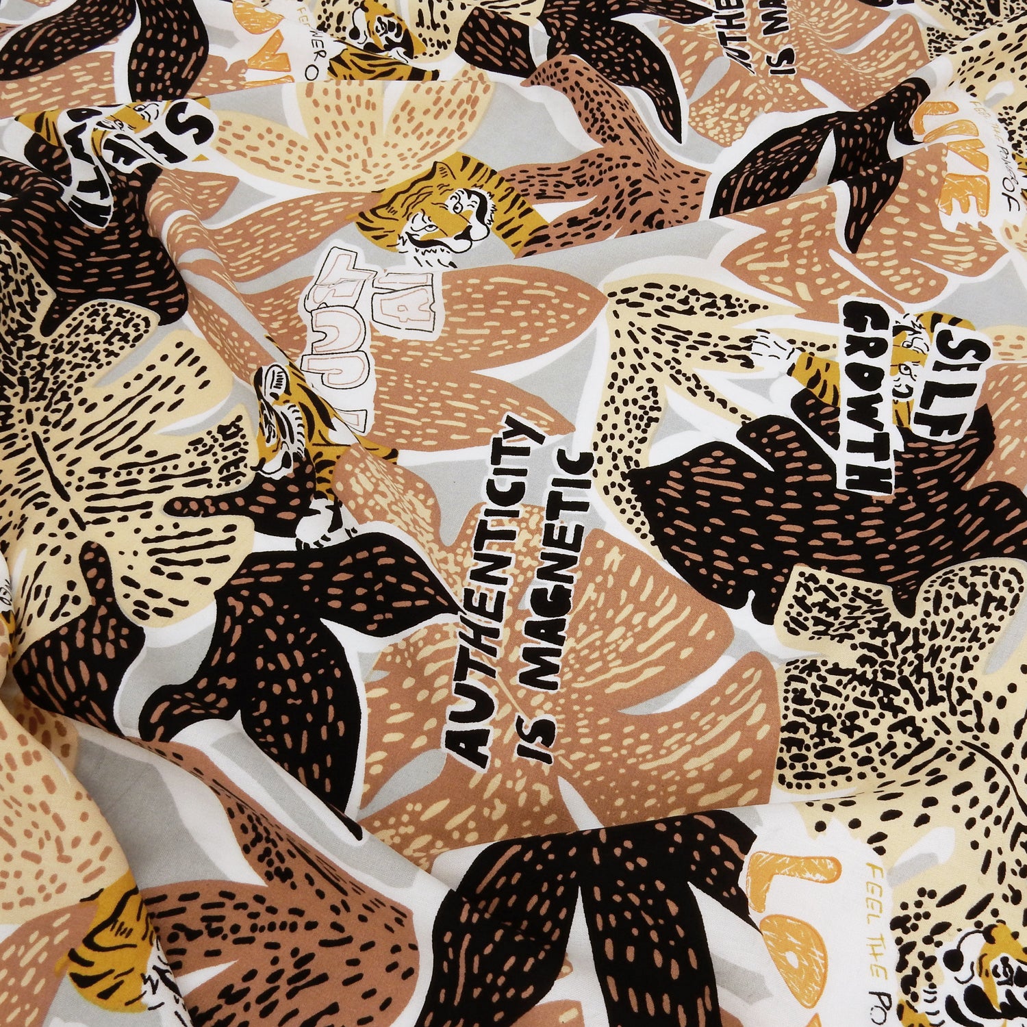 Premium 100% Rayon Challis Fabric. African-inspired print, gray, coral & brown. light weight, ultra soft, silk like texture. shown lightly gathered