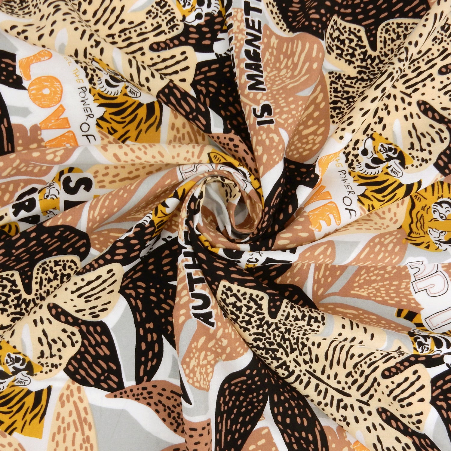 Premium 100% Rayon Challis Fabric. African-inspired print, gray, coral & brown. light weight, ultra soft, silk like texture. shown swirled