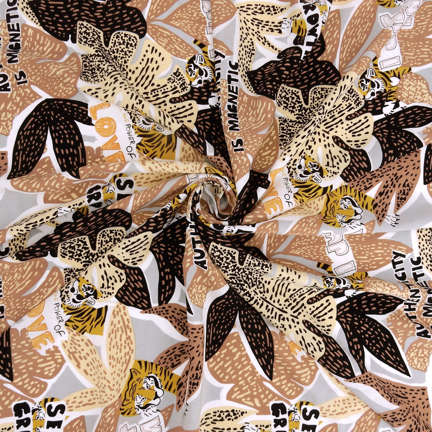 Premium 100% Rayon Challis Fabric. African-inspired print, gray, coral & brown. light weight, ultra soft, silk like texture. shown swirled