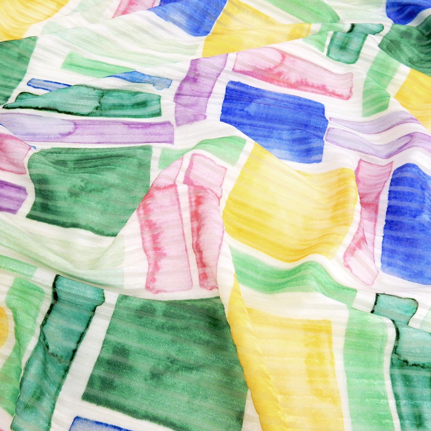 Premium Spanish Geometric Burnout Stretch Velvet fabric. Pastel Multi-Color & Ivory rectangle & square design on 4-way stretch burnout velvet. shown lightly gathered