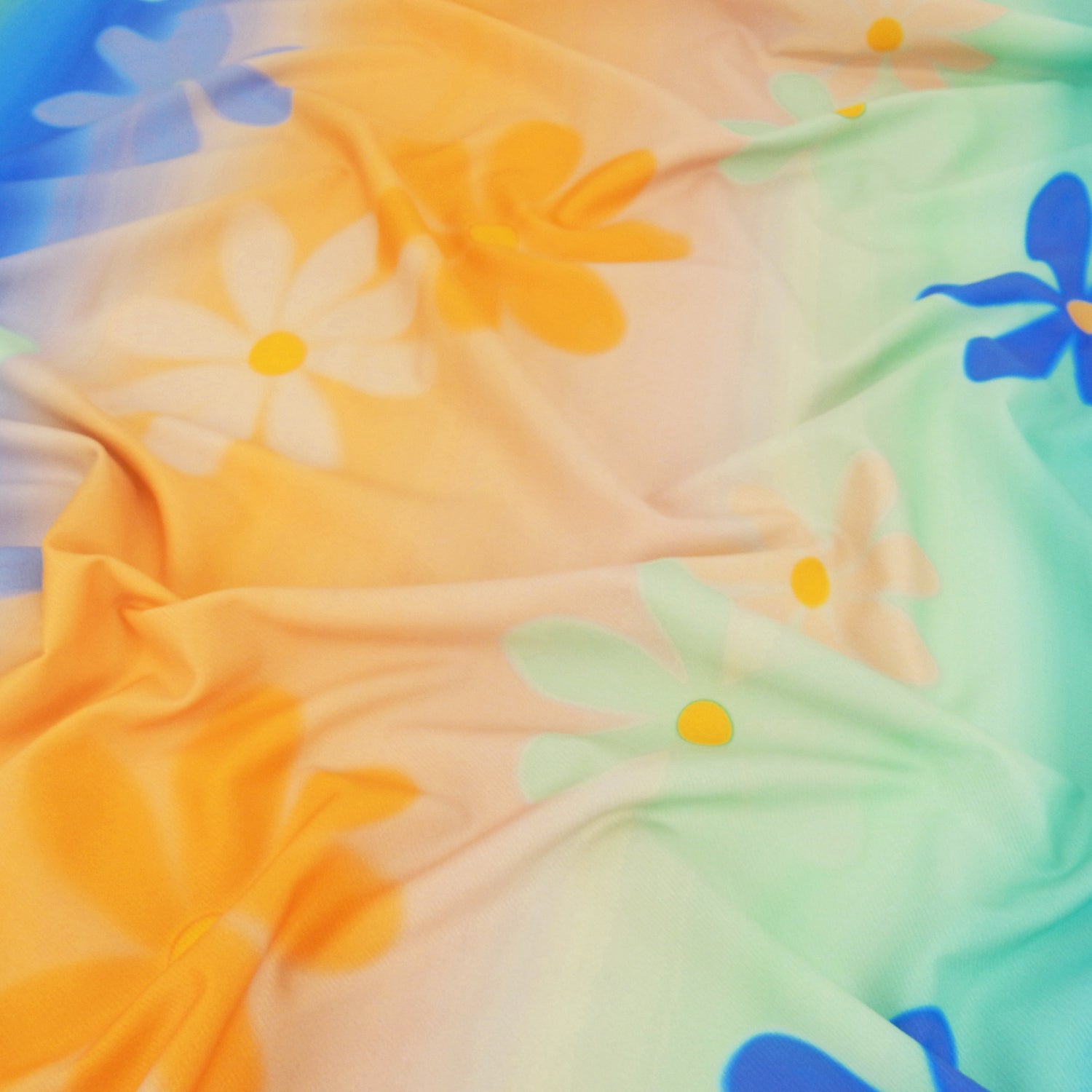 Premium Spanish Floral Twill Dress Fabric. Modern multicolored Vertical Railroaded Stripe with floral design printed on dress weight polyester spandex twill. shown lightly gathered
