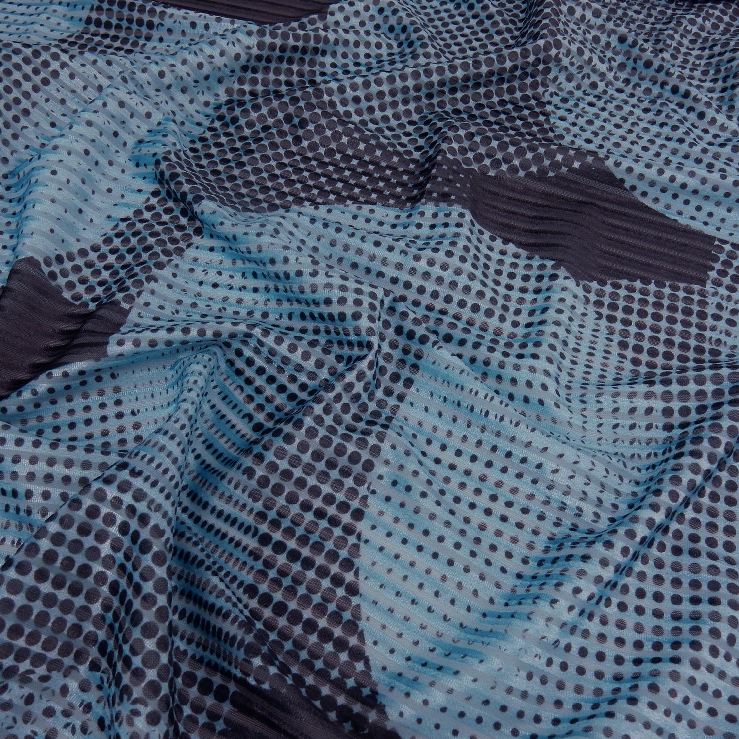 Premium Spanish Geometric Velvet Burnout Stretch Fabric. Elegant Dusty Blue Dotted circle design on 4-way stretch burnout velvet. shown lightly gathered
