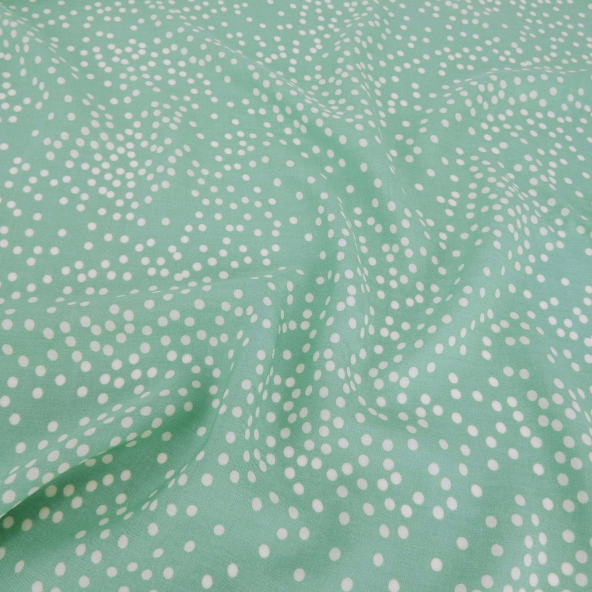 Premium 100% Rayon Challis Fabric. Artfully Spaced Polka Dot on Soft Mint. lightweight & ultra soft. shown lightly gathered