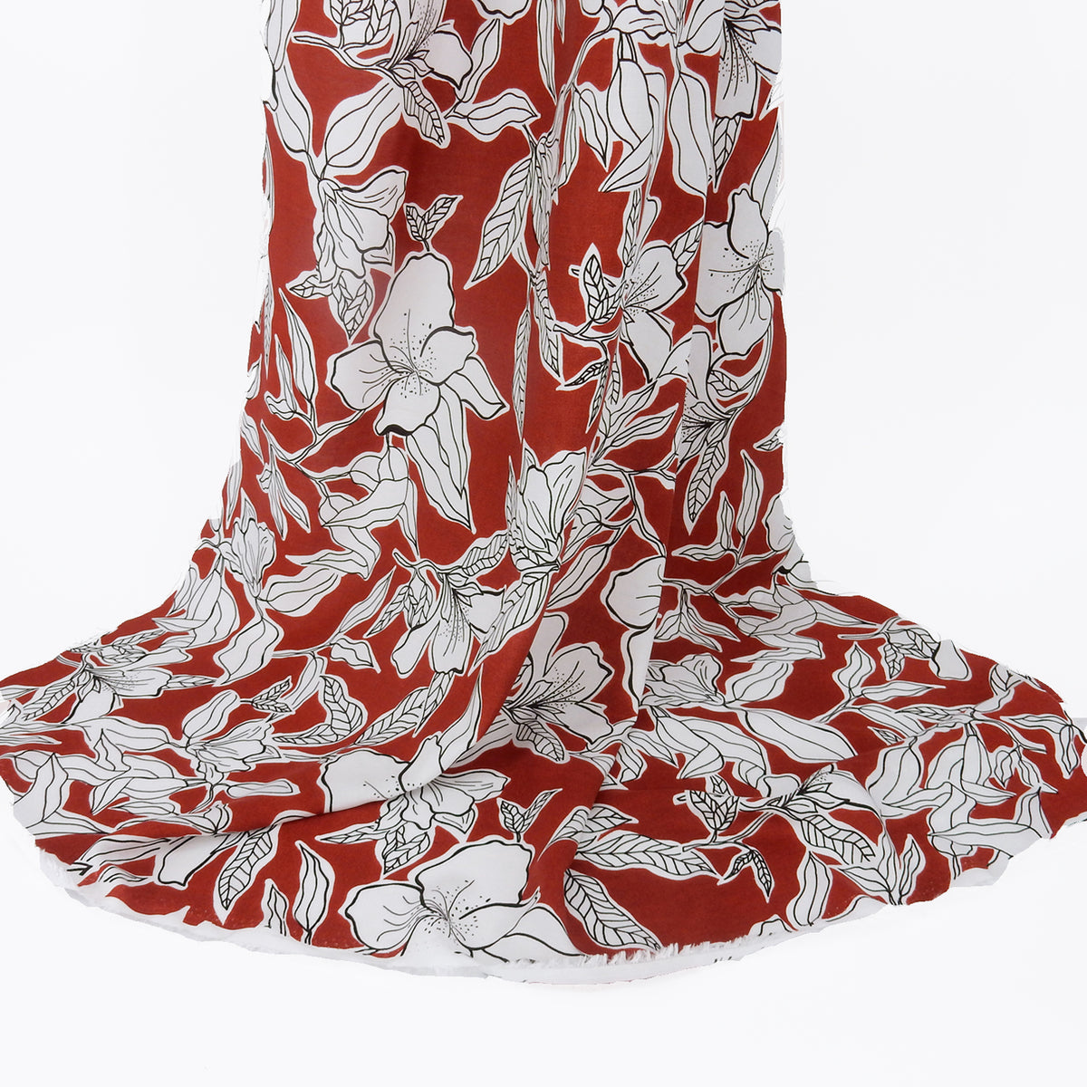 Premium 100% Rayon Challis Fabric. Minimalist White Lily in Deep Rust & Crisp White. lightweight & ultra soft. shown draped