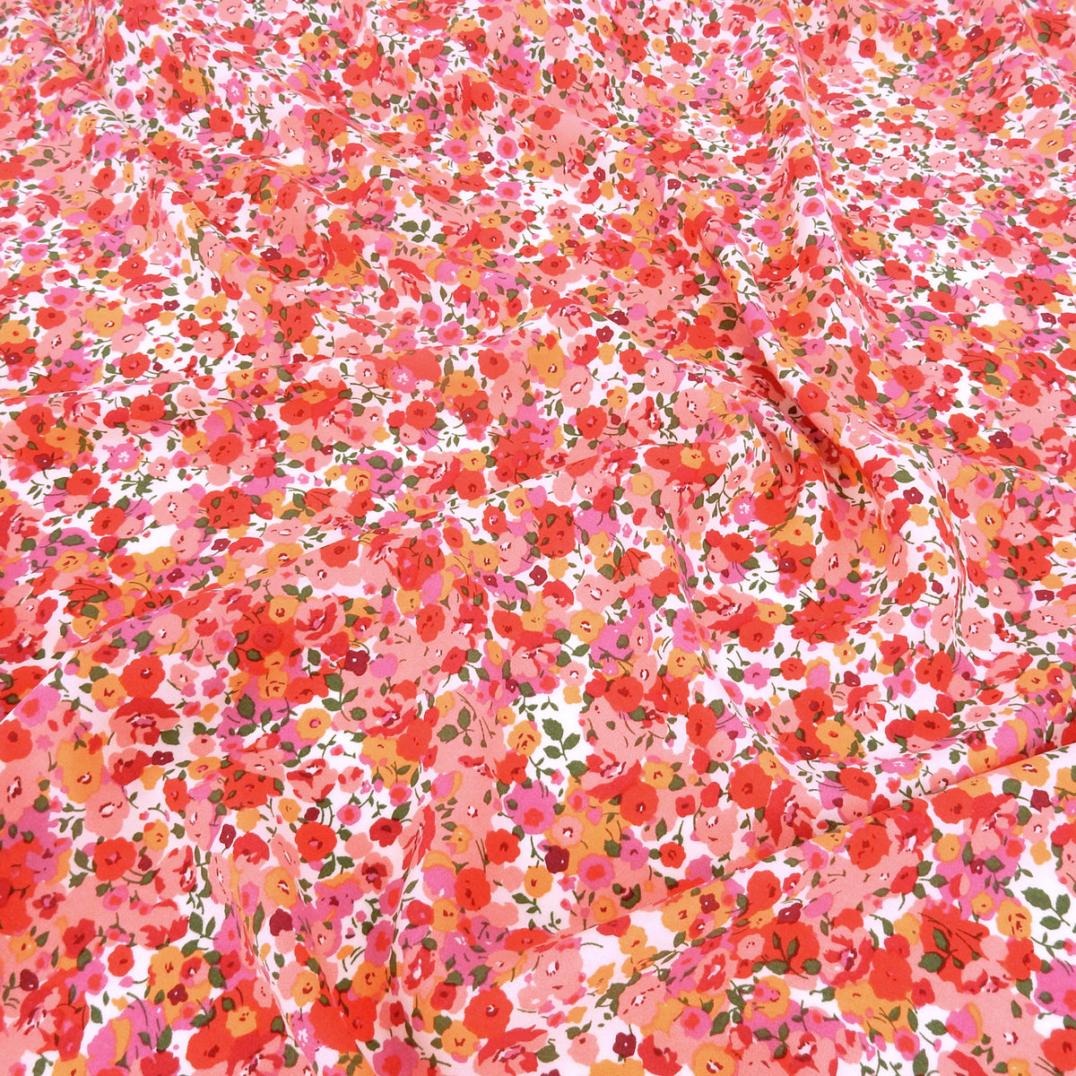 Premium 100% Rayon Challis Fabric. Radiant Millefleurs Floral in Coral, Fuchsia, Red & Peach. lightweight & ultra soft. shown lightly gathered