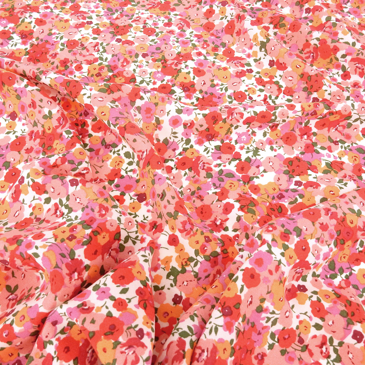 Premium 100% Rayon Challis Fabric. Radiant Millefleurs Floral in Coral, Fuchsia, Red & Peach. lightweight & ultra soft. shown lightly gathered