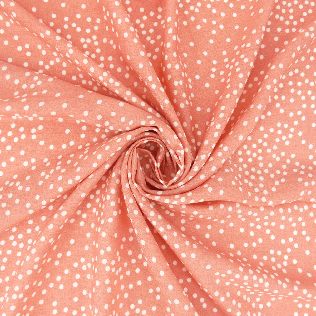 Premium 100% Rayon Challis Fabric. Artfully Spaced Polka Dot on Soft Coral. lightweight & ultra soft. shown swirled