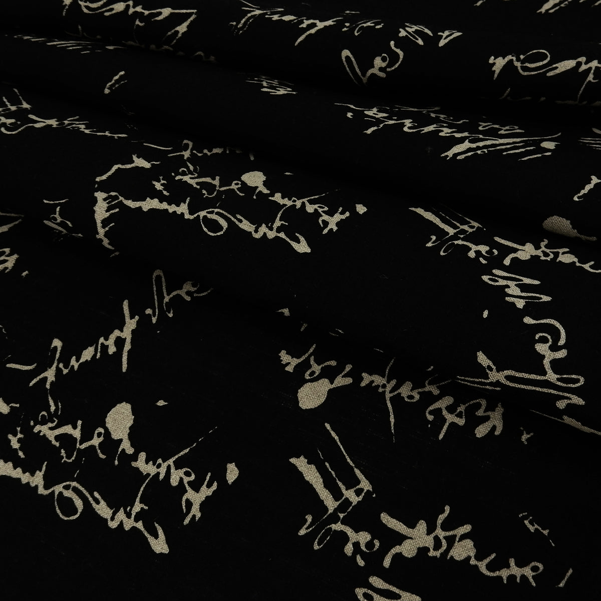 Premium 100% European Linen Printed Script Fabric - Black & Undyed Natural. versatile apparel & high-end home decor. shown pleated