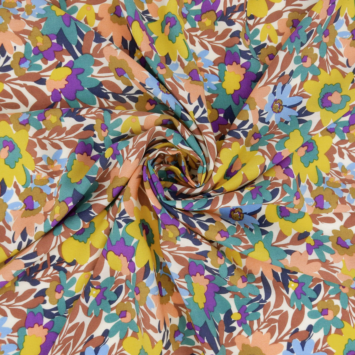Premium 100% Rayon Challis Fabric. Vibrant Botanical on Creamy White. lightweight & ultra soft. shown swirled