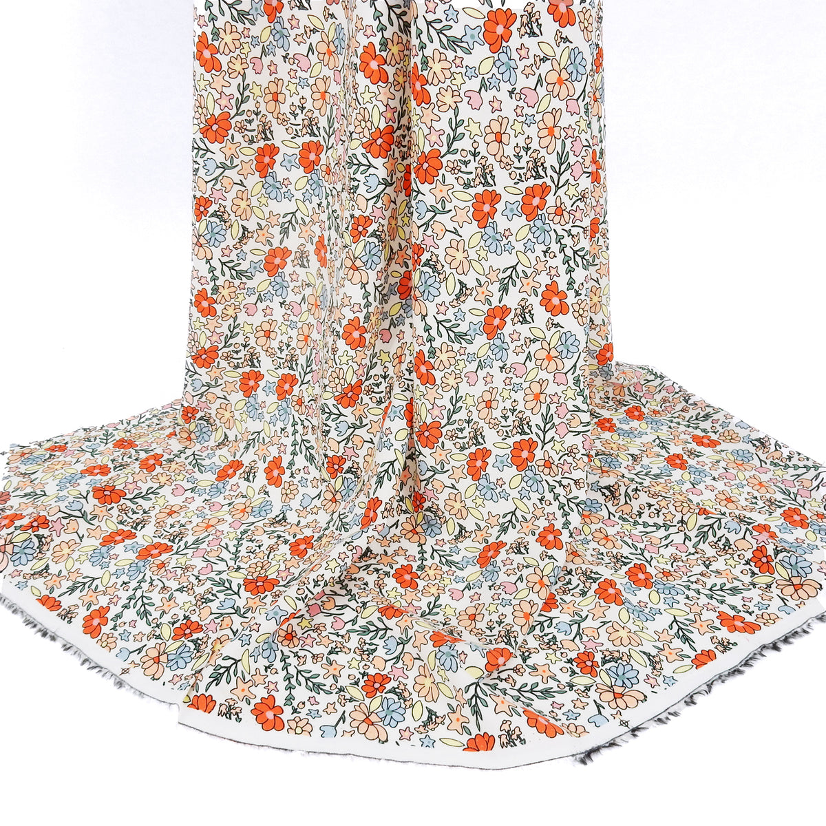 Premium 100% Rayon Challis Fabric. Playful Millefleurs Floral in Burnt Orange, Peach, Dusty Blue, Soft Yellow & Pink. lightweight & ultra soft. shown draped