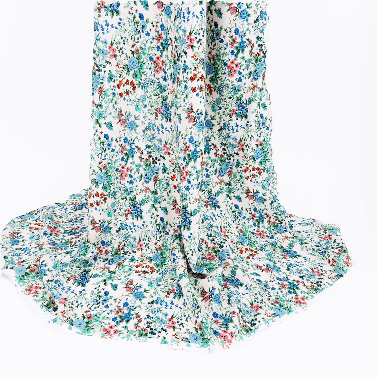 Premium 100% Rayon Challis Fabric. Playful Millefleurs Floral in Sky Blue, Terracotta, Royal Blue on Cream lightweight & ultra soft. shown draped