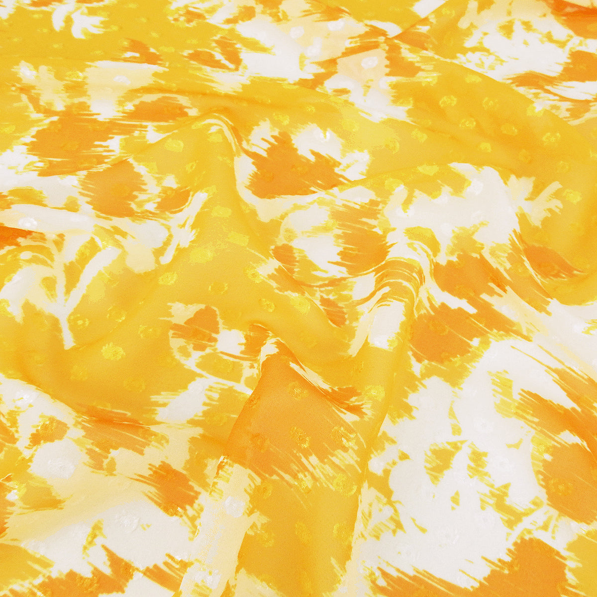 Premium 100% Rayon Challis Fabric. Printed clip dot watercolor in golden yellow, orange & soft cream. Semi-sheer with raised clip dots. shown lightly gathered