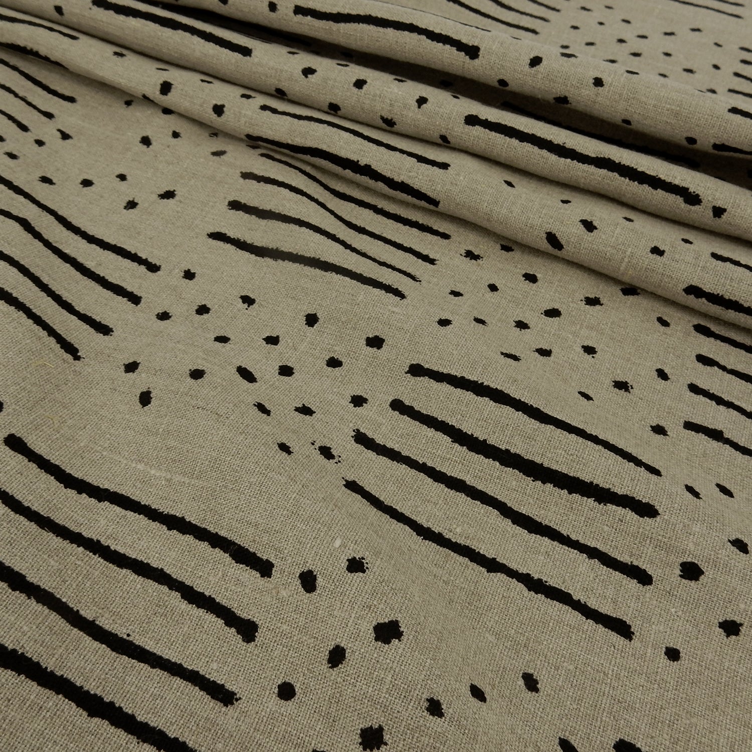 Premium 100% European Linen fabric. African-Inspired natural & black line/dot design. medium weight for apparel & home interior. shown pleated