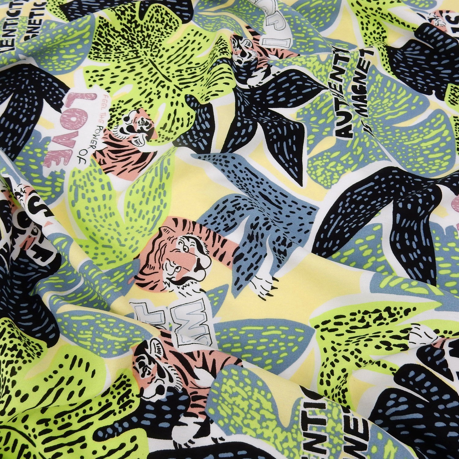 Premium 100% Rayon Challis Fabric. African-inspired print Lime Green. light weight, ultra soft, silk like texture. shown lightly gathered