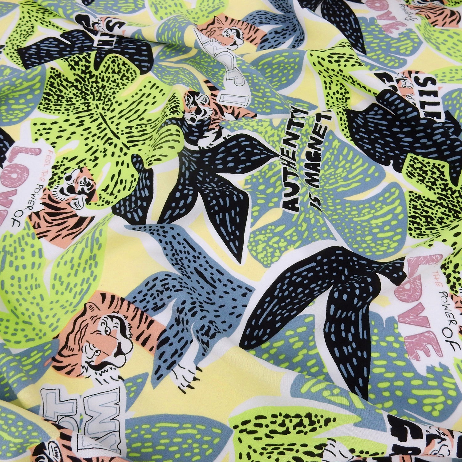 Premium 100% Rayon Challis Fabric. African-inspired print Lime Green. light weight, ultra soft, silk like texture. shown lightly gathered