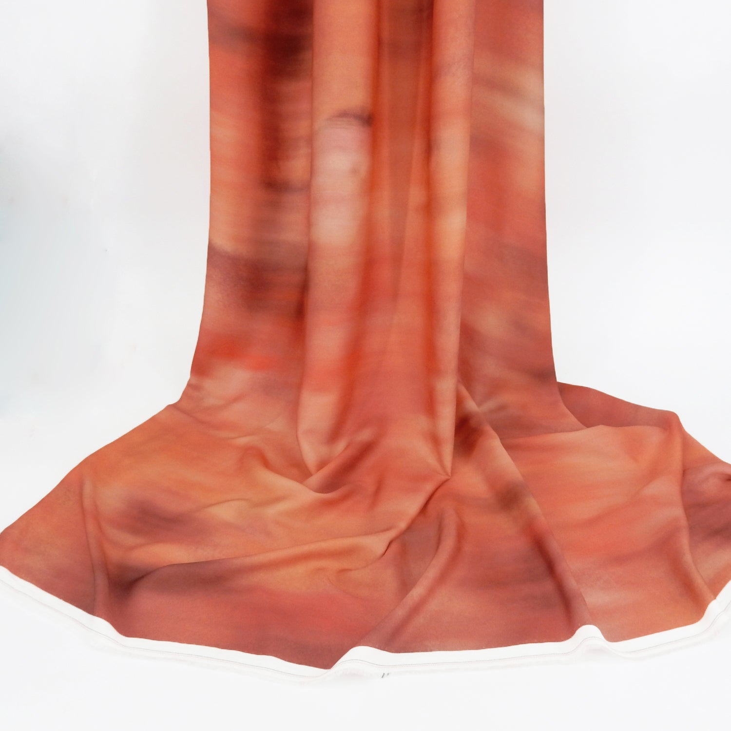 Premium 100% Rayon Challis Fabric. Watercolor ombre' design in coral-rose with lightweight, ultra soft, silk like texture. shown draped