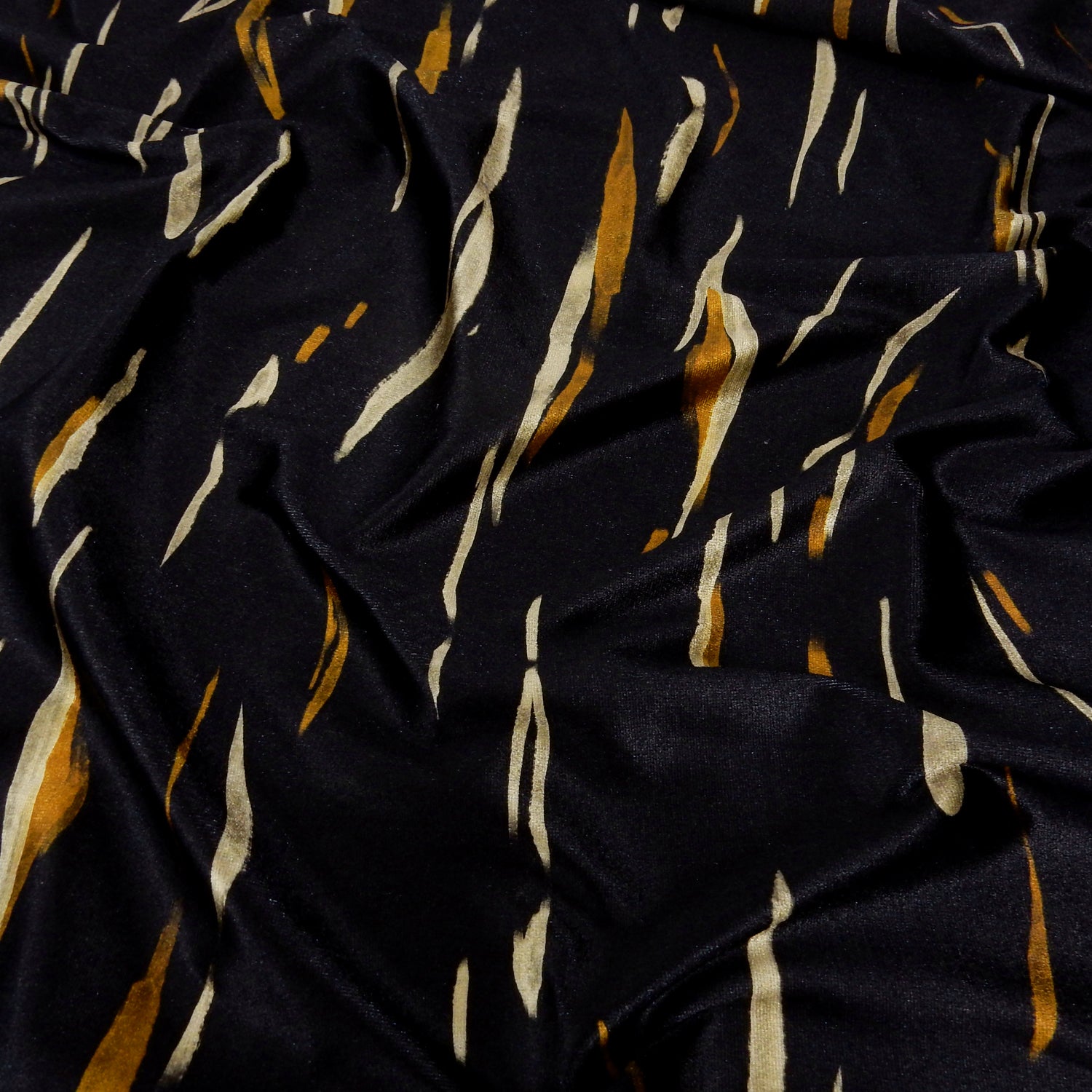 Premium Spanish Vertical Abstract Stripe Stretch Velvet Fabric. Luxury Bronze & Pale Gold design. shown lightly gathered