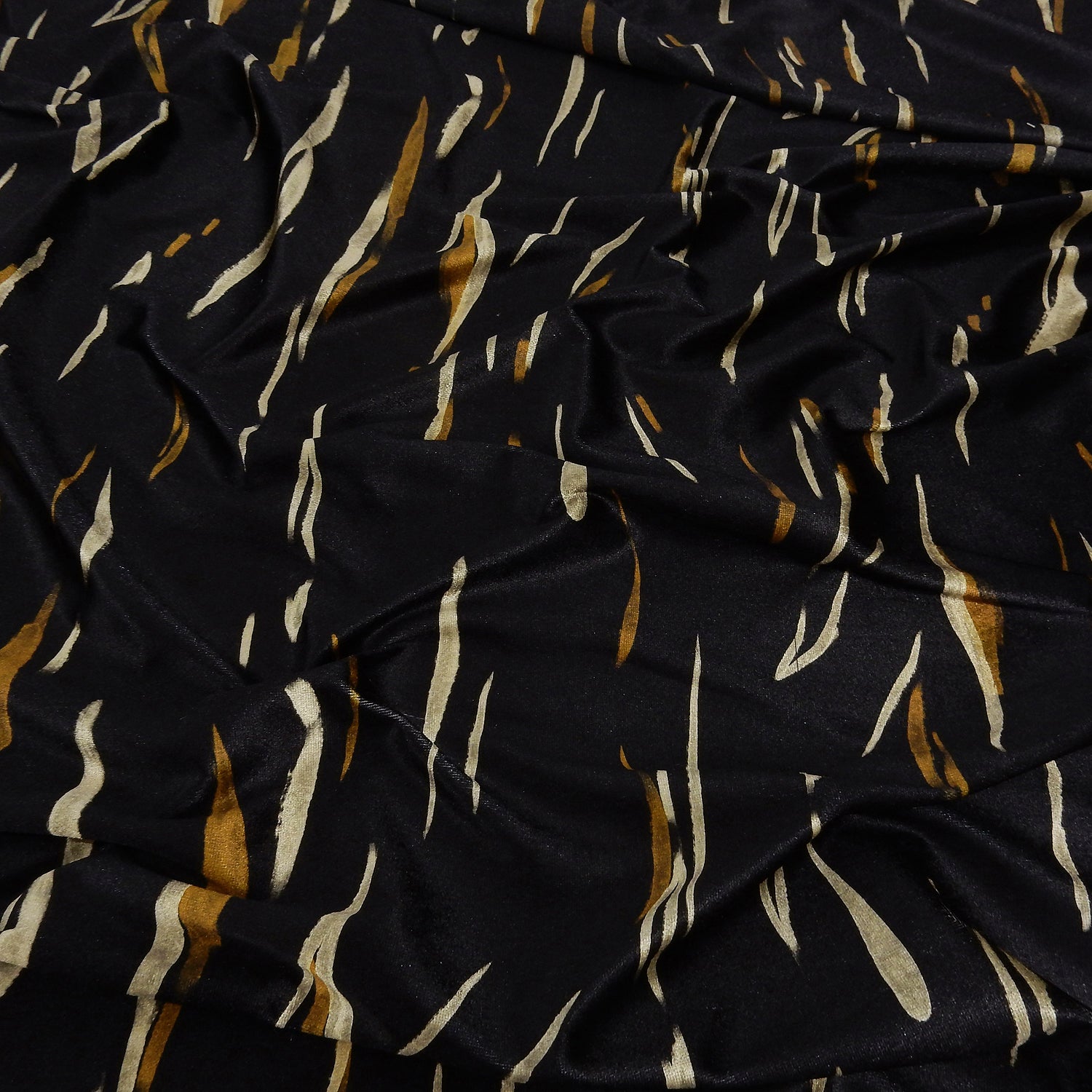 Premium Spanish Vertical Abstract Stripe Stretch Velvet Fabric. Luxury Bronze & Pale Gold design. shown lightly gathered