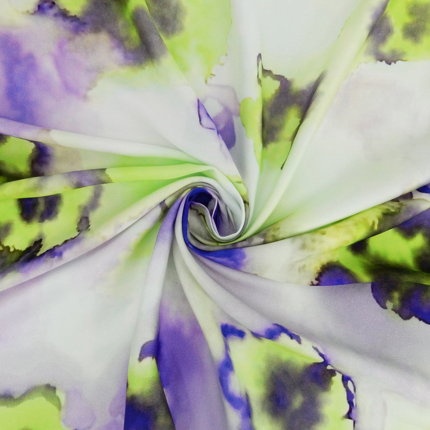 Premium 100% Rayon Challis Fabric. Foral Watercolor Print in Lime Green and purple. lightweight, ultra soft, silk like texture. shown swirled