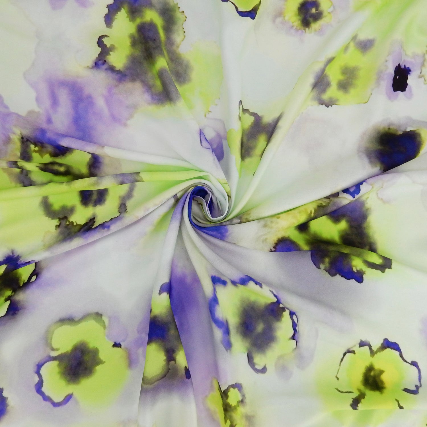 Premium 100% Rayon Challis Fabric. Foral Watercolor Print in Lime Green and purple. lightweight, ultra soft, silk like texture. shown swirled