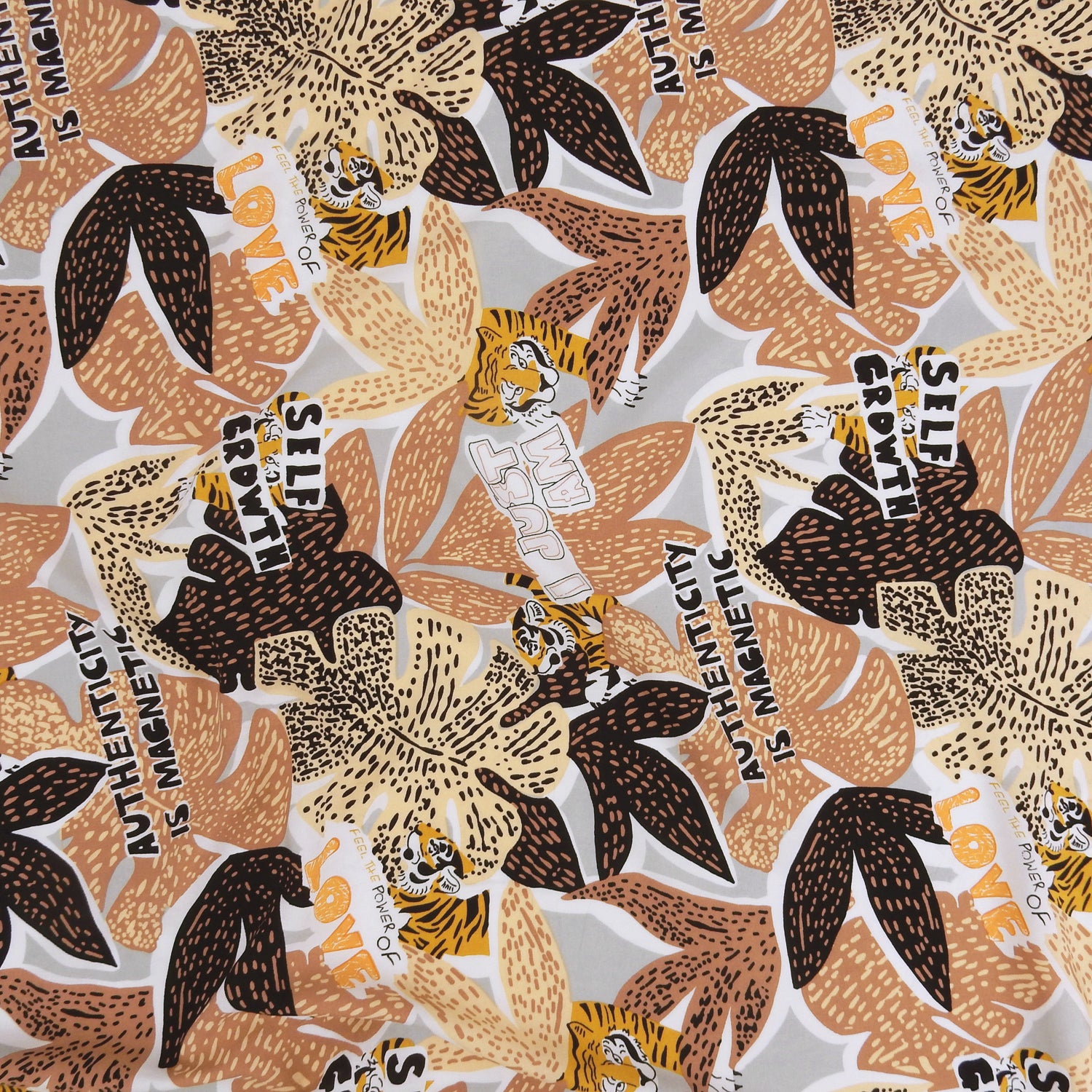Premium 100% Rayon Challis Fabric. African-inspired print, gray, coral & brown. light weight, ultra soft, silk like texture. shown flat