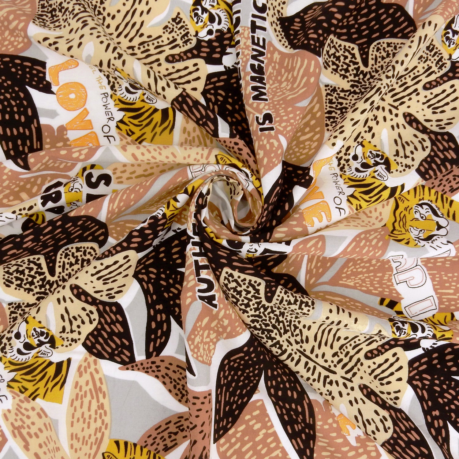 Premium 100% Rayon Challis Fabric. African-inspired print, gray, coral & brown. light weight, ultra soft, silk like texture. shown swirled