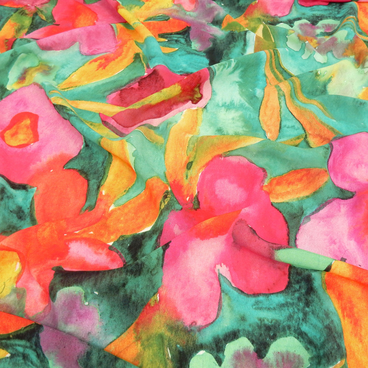 Premium watercolor floral semi-sheer dress fabric. Luxury tropical Bloom design on premium polyester. Shown lightly gathered