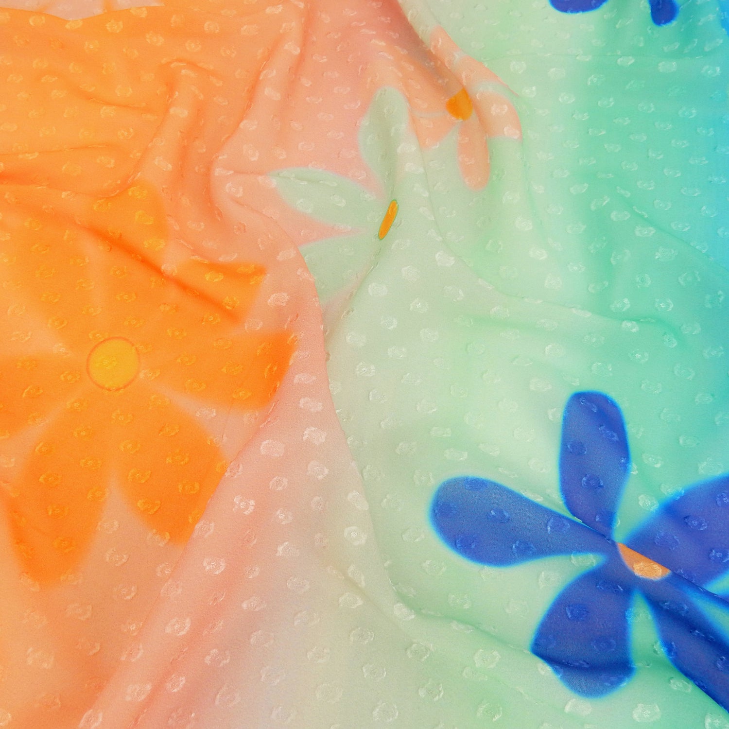 Premium floral printed clip dot fabric. semi sheer with raised clip dots. Modern flower design on multicolor railroad stripe. shown lightly gathered