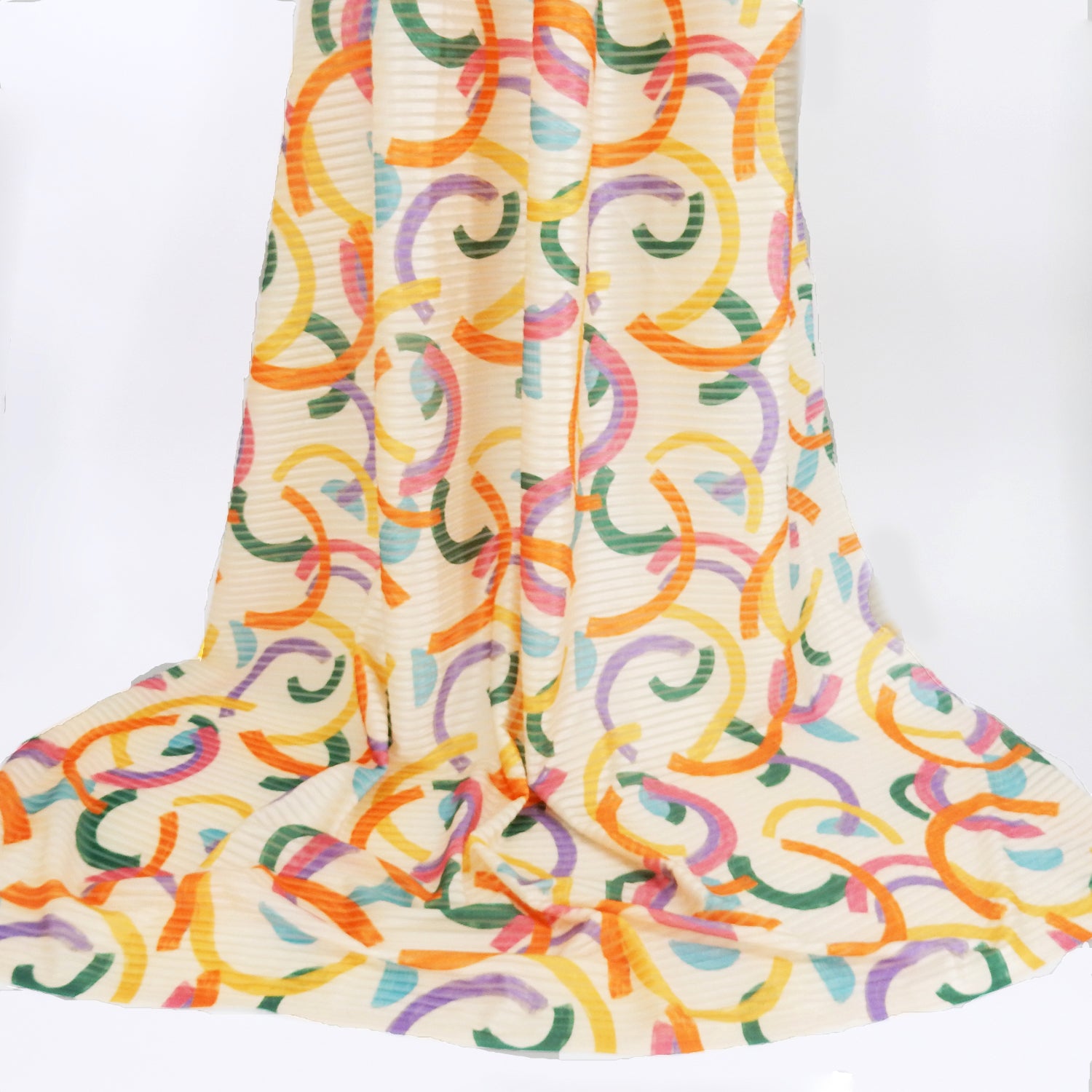 Premium Spanish Geometric Burnout Stretch Velvet fabric.  Multi-Color half cirlces on cream 4-way stretch burnout velvet. shown draped