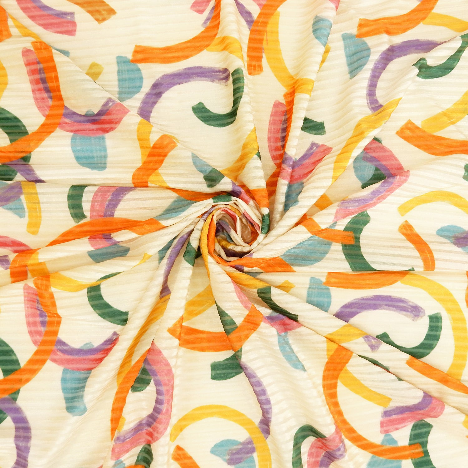 Premium Spanish Geometric Burnout Stretch Velvet fabric.  Pastel Multi-Color & Ivory rectangle & square design on 4-way stretch burnout velvet. shown swirled