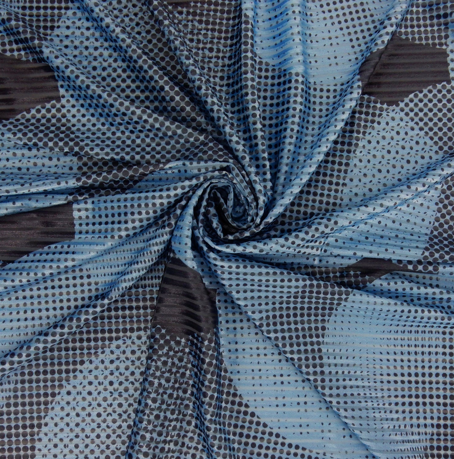 Premium Spanish Geometric Velvet Burnout Stretch Fabric. Elegant Dusty Blue Dotted circle design on 4-way stretch burnout velvet. shown swirled