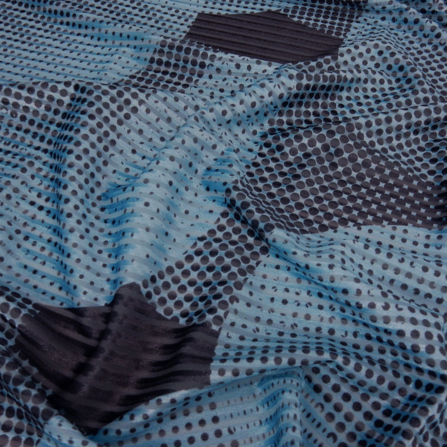 Premium Spanish Geometric Velvet Burnout Stretch Fabric. Elegant Dusty Blue Dotted circle design on 4-way stretch burnout velvet. shown lightly gathered