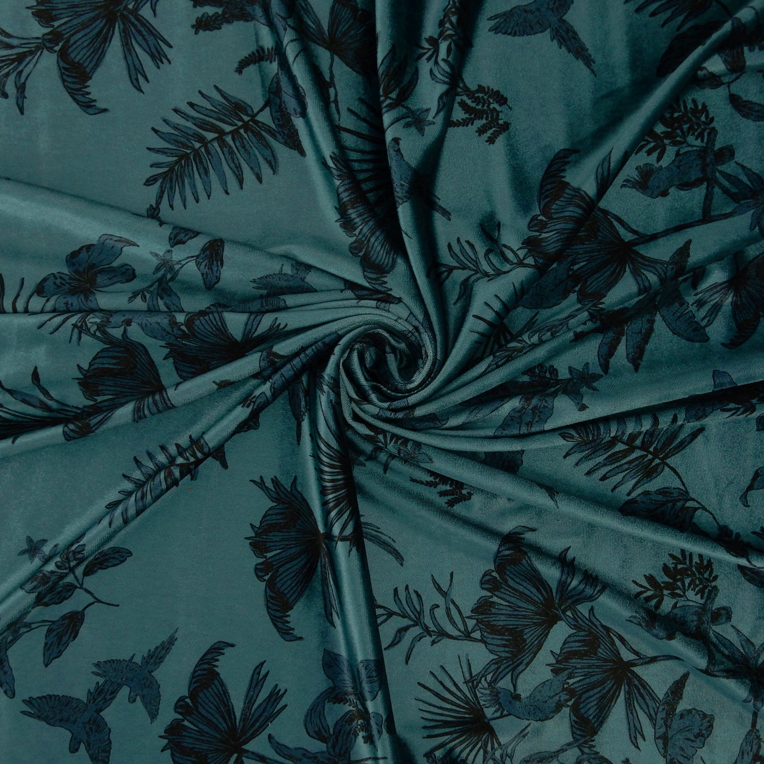 Premium Spanish minimalist floral stretch velvet dress fabric. Luxury Tone-on-Tone Teal design on polyester  spandex velvet. Shown swirled