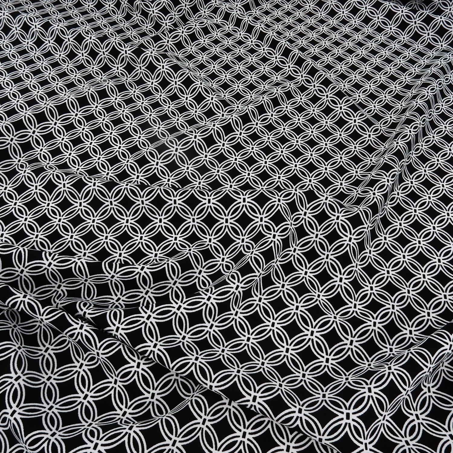 Black & White Geometric Circular Grid – Silky Smooth Stretch Dress Fabric CLF1-856