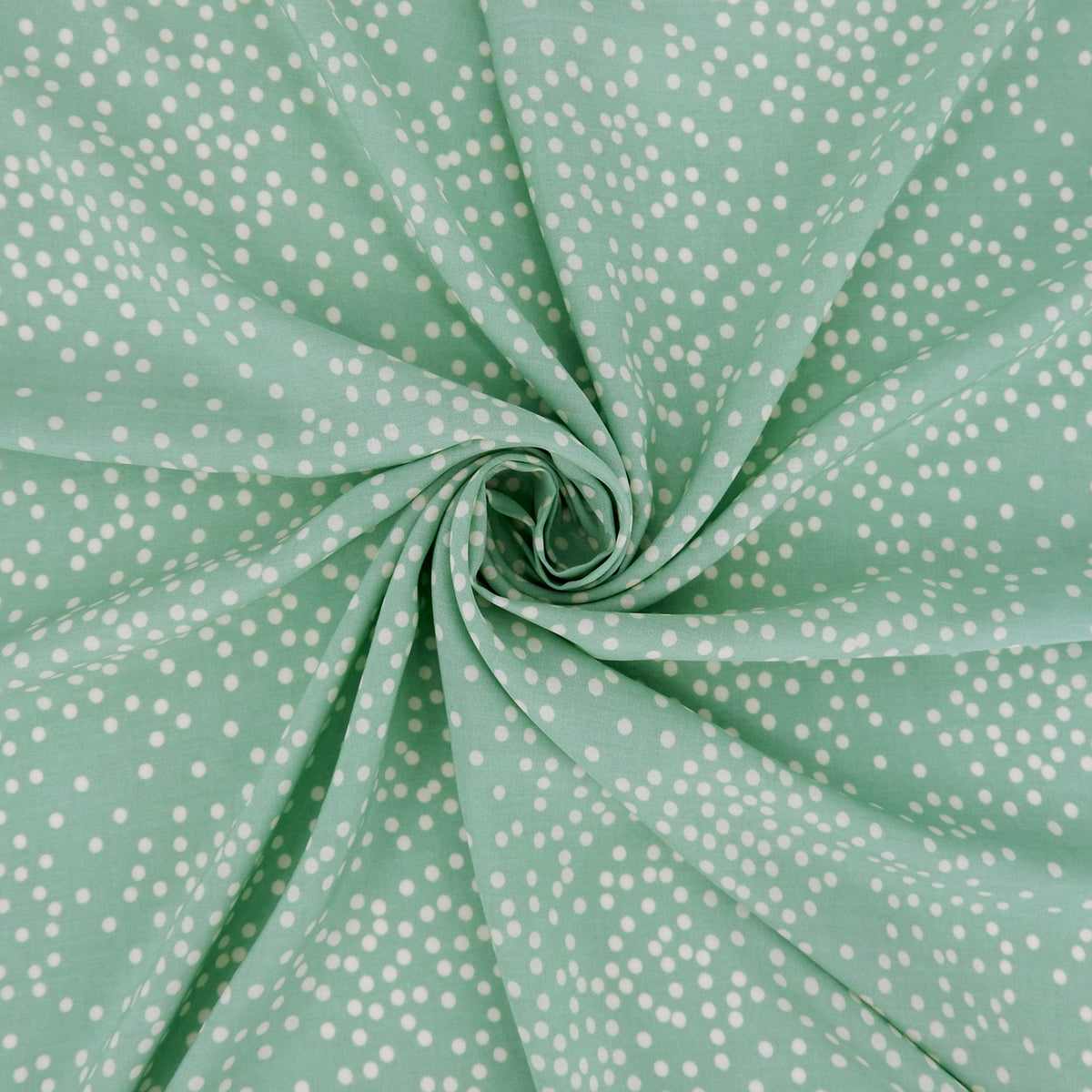 Premium 100% Rayon Challis Fabric. Artfully Spaced Polka Dot on Soft Mint. lightweight & ultra soft. shown swirled