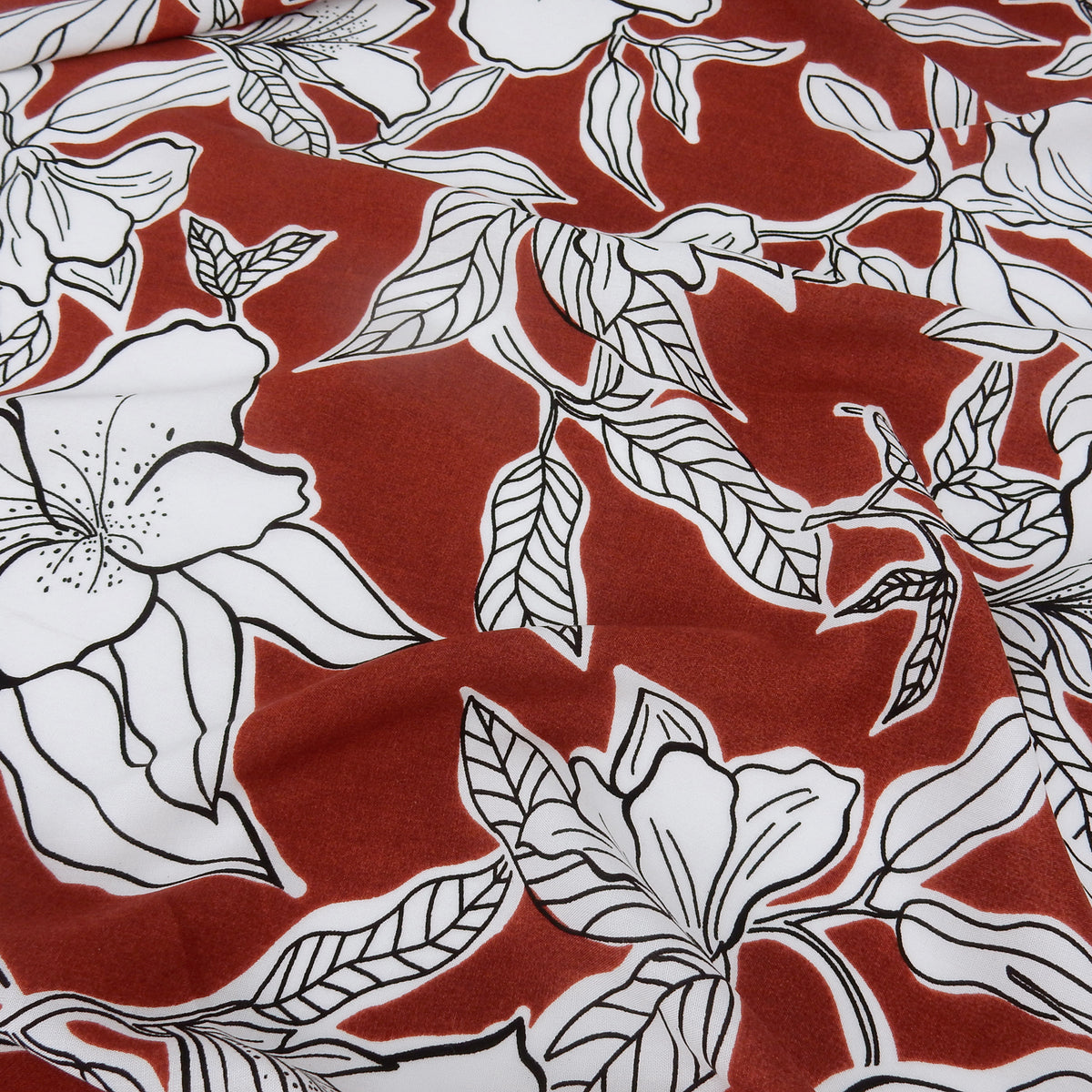 Premium 100% Rayon Challis Fabric. Minimalist White Lily in Deep Rust & Crisp White. lightweight & ultra soft. shown lightly gathered