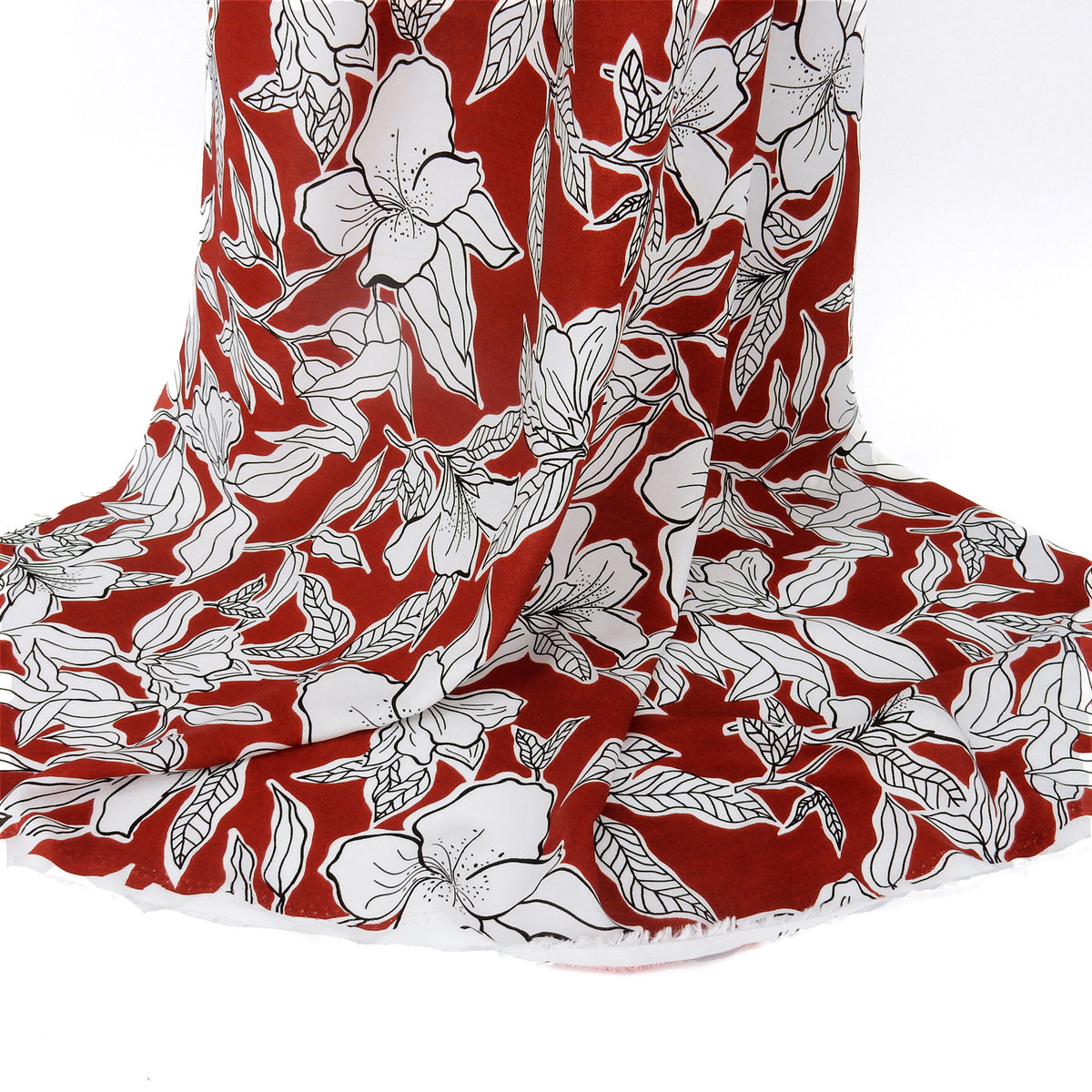 Premium 100% Rayon Challis Fabric. Minimalist White Lily in Deep Rust & Crisp White. lightweight & ultra soft. shown draped