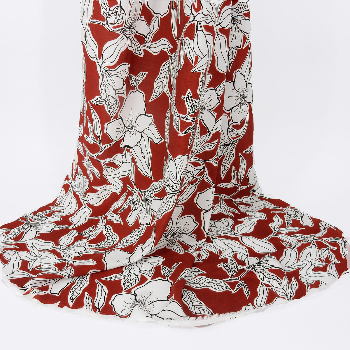 Premium 100% Rayon Challis Fabric. Minimalist White Lily in Deep Rust & Crisp White. lightweight & ultra soft. shown draped