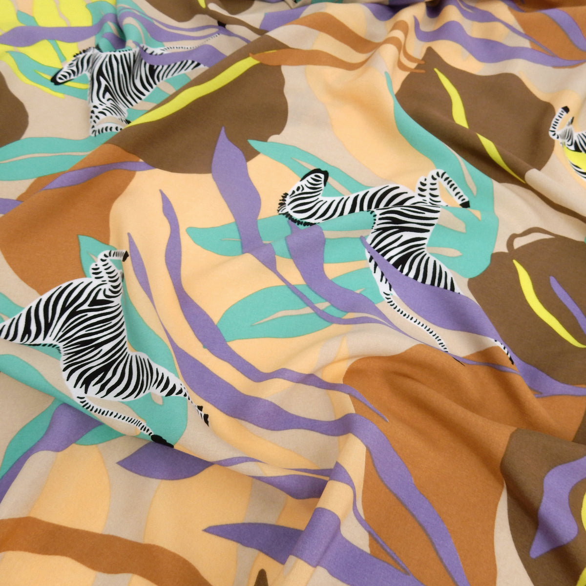 Premium 100% Rayon Challis Fabric. Artistic Zebra Safari Print in Peach, Taupe, Lavender, Beige & Yellow. lightweight & ultra soft. shown lightly gathered