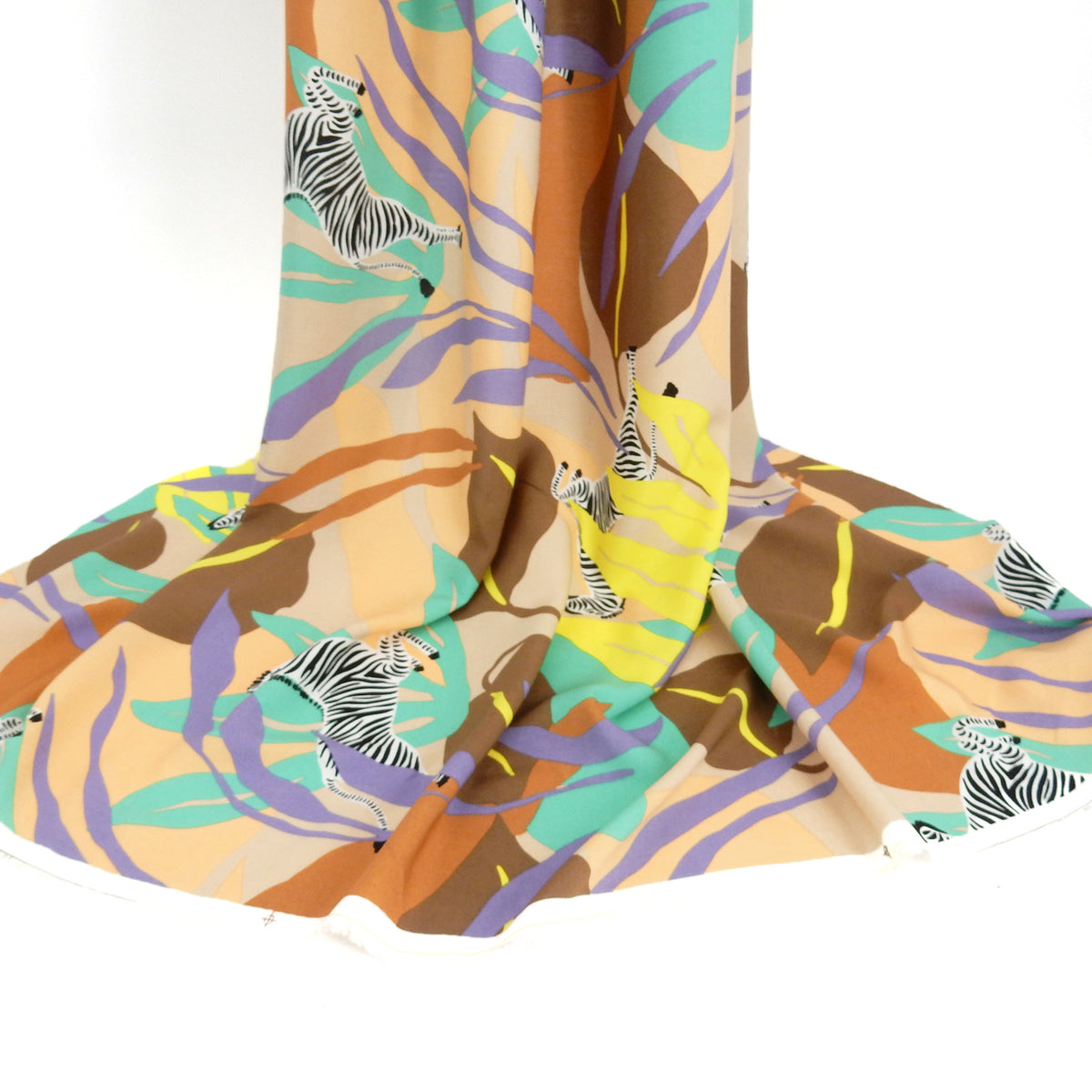 Premium 100% Rayon Challis Fabric. Artistic Zebra Safari Print in Peach, Taupe, Lavender, Beige & Yellow. lightweight & ultra soft. shown draped