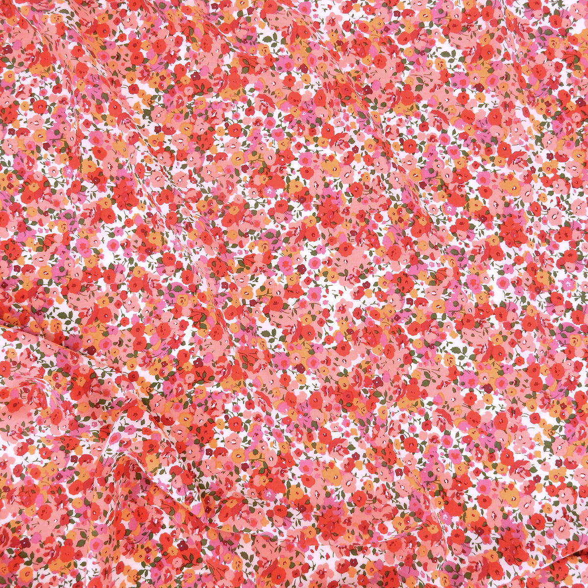 Premium 100% Rayon Challis Fabric. Radiant Millefleurs Floral in Coral, Fuchsia, Red & Peach. lightweight & ultra soft. shown lightly gathered
