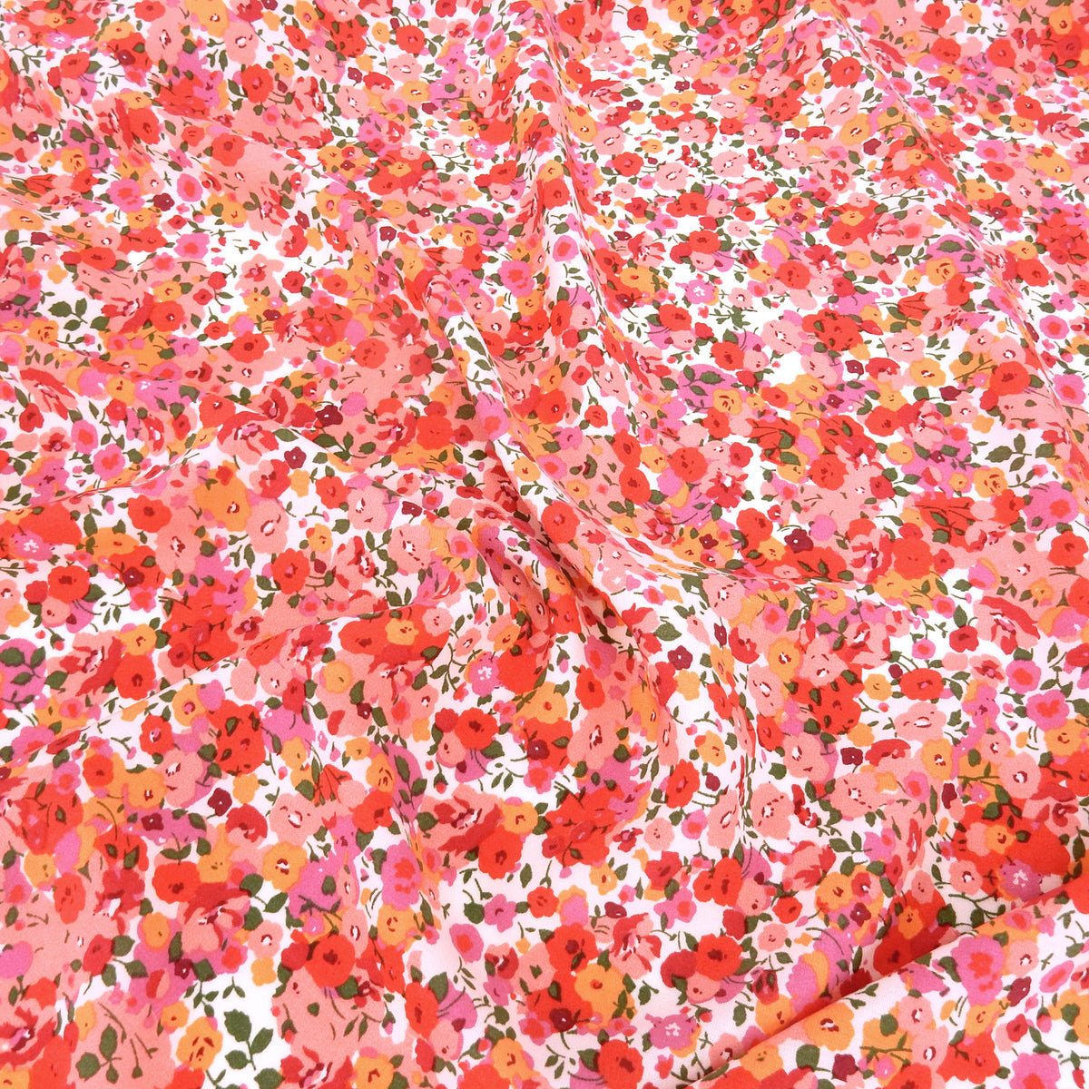 Premium 100% Rayon Challis Fabric. Radiant Millefleurs Floral in Coral, Fuchsia, Red & Peach. lightweight & ultra soft. shown lightly gathered