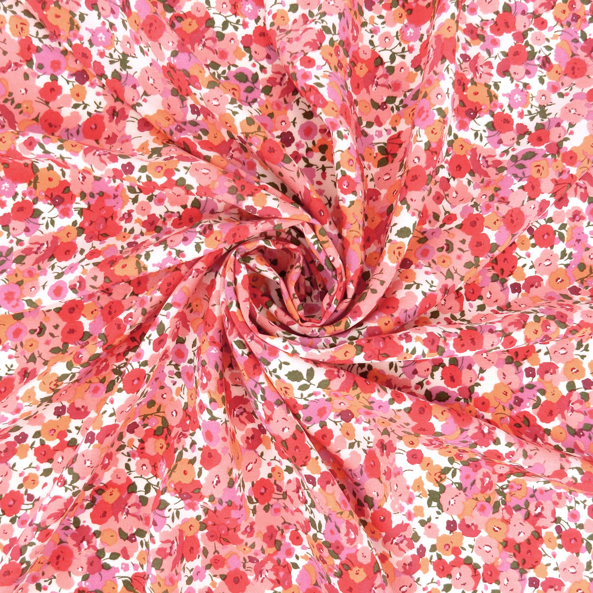 Premium 100% Rayon Challis Fabric. Radiant Millefleurs Floral in Coral, Fuchsia, Red & Peach. lightweight & ultra soft. shown swirled