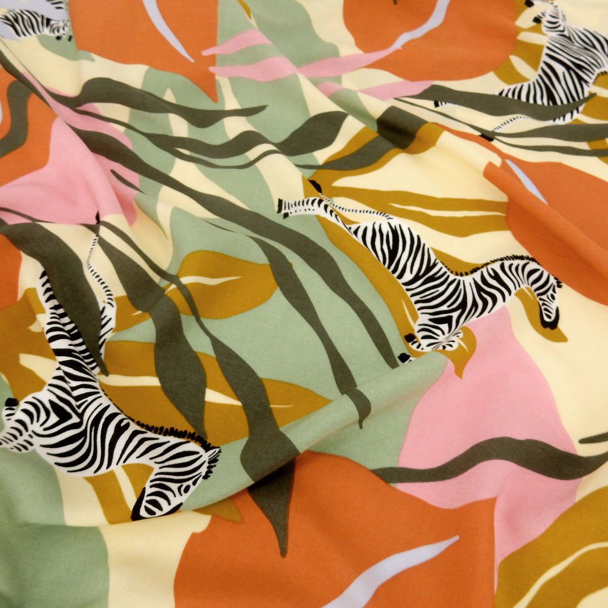 Premium 100% Rayon Challis Fabric. Artistic Zebra Safari Print in Terracotta, Sage & Soft Cream. lightweight & ultra soft. shown lightly gathered