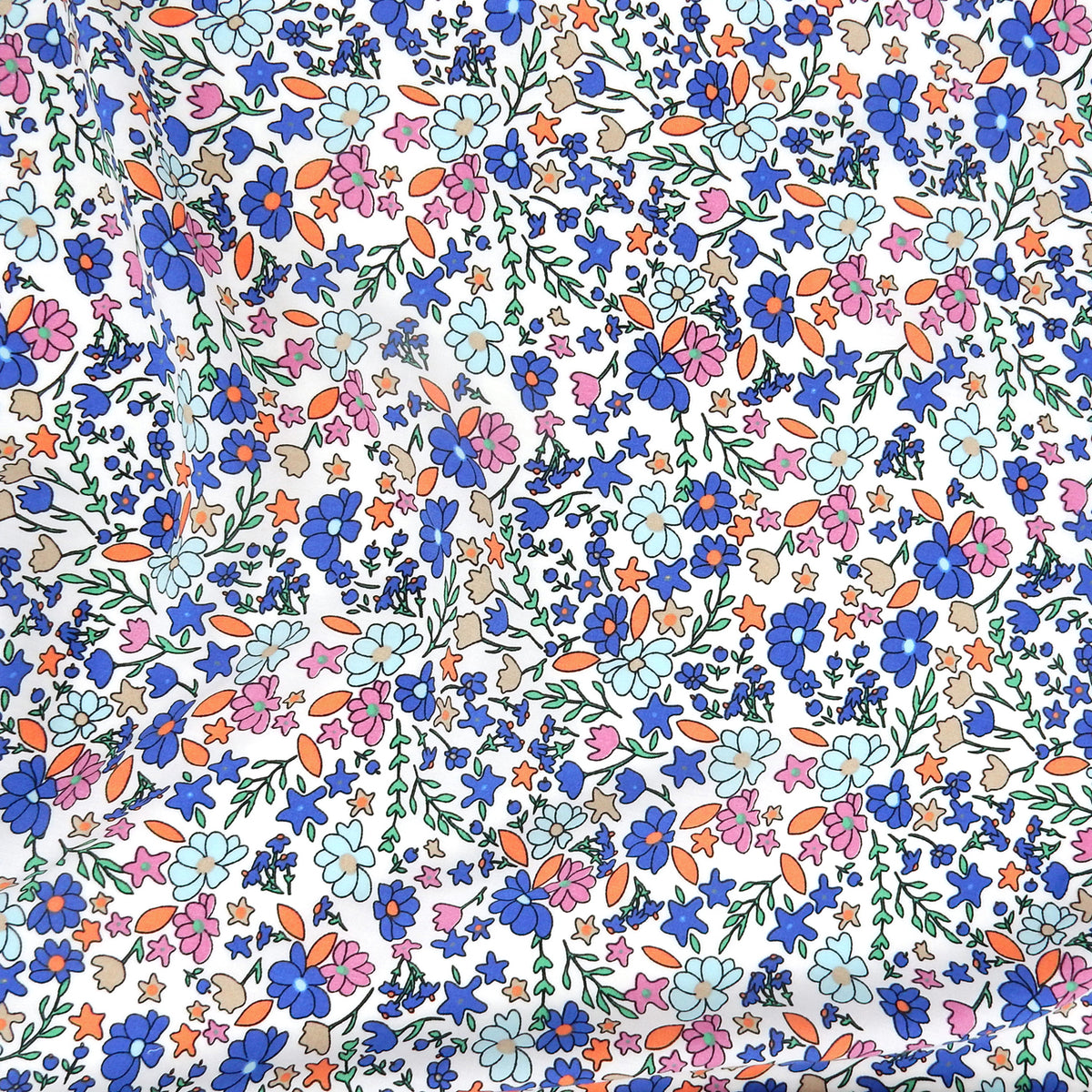 Premium 100% Rayon Challis Fabric. Playful Millefleurs Floral in Periwinkle, Berry & Coral. lightweight & ultra soft. shown lightly gathered