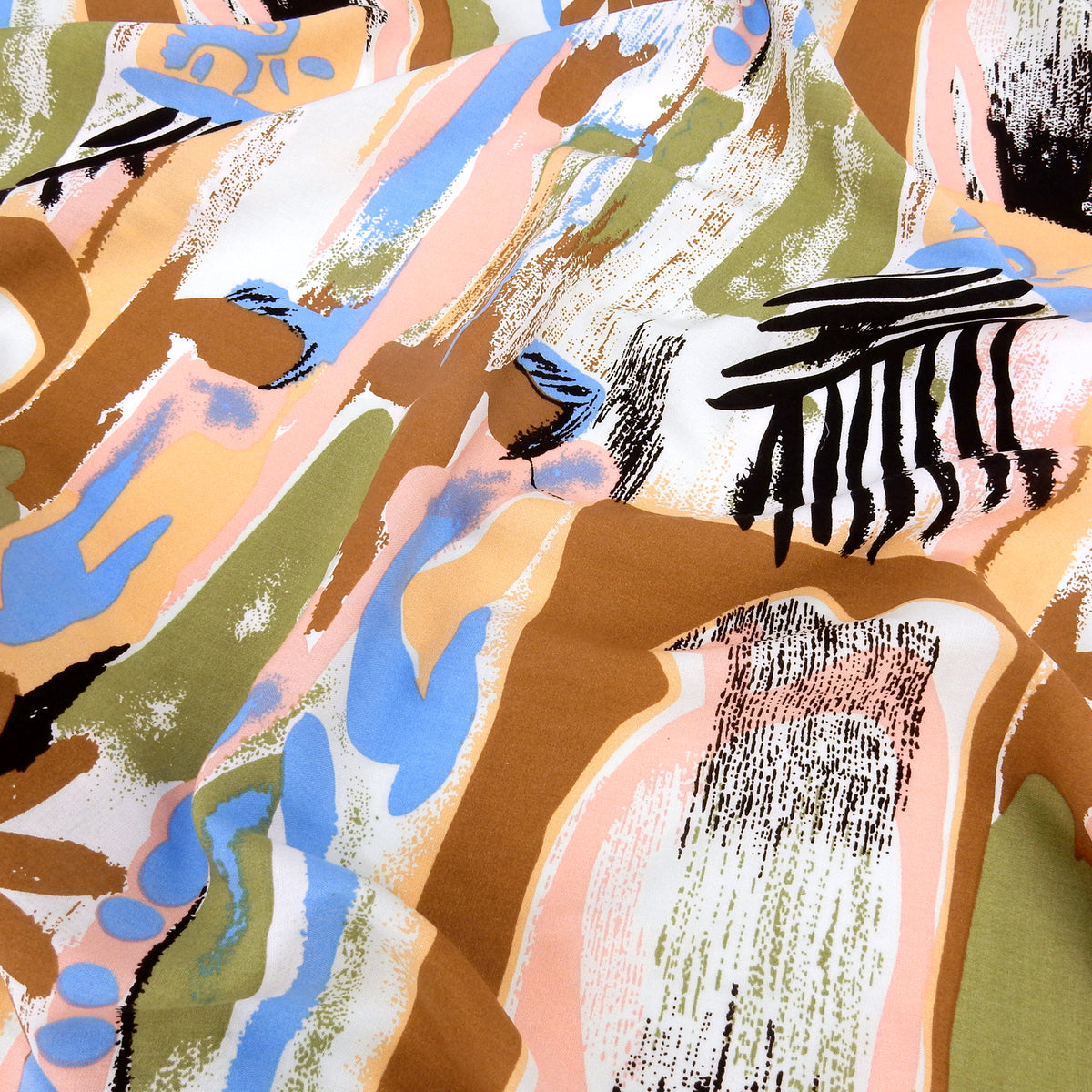 Premium 100% Rayon Challis Fabric. Modern Directional Batik Tropical in Cocoa, Sage & Soft Cream. lightweight & ultra soft. Shown lightly gathered