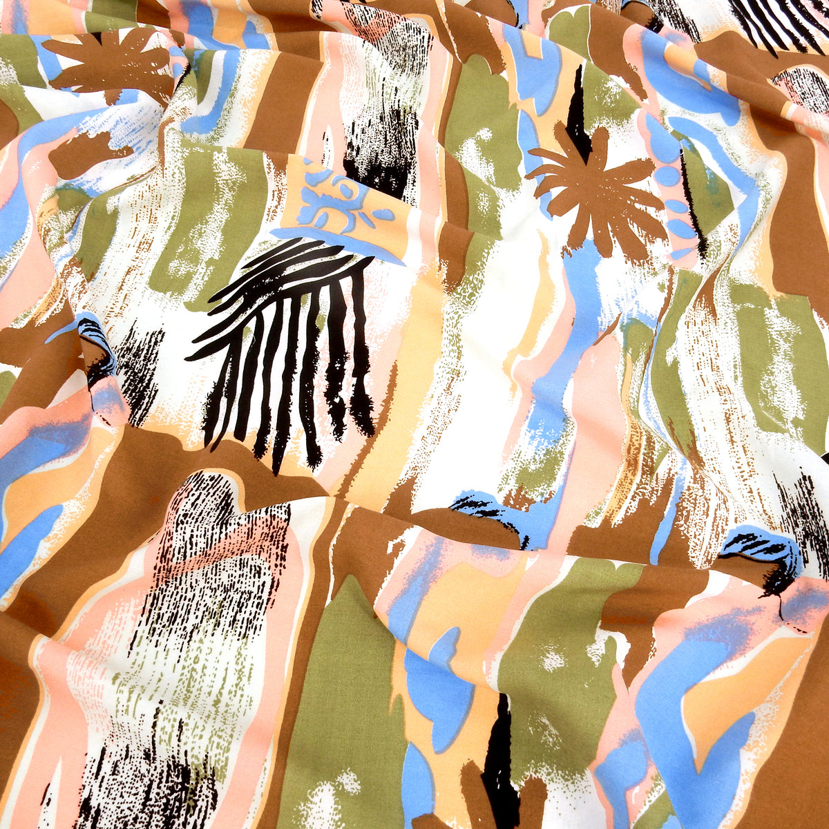 Premium 100% Rayon Challis Fabric. Modern Directional Batik Tropical in Cocoa, Sage & Soft Cream. lightweight & ultra soft. Shown lightly gathered